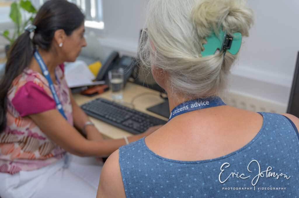 Photography for Citizens Advice 4 Citizens Advice volunteer speaking with a colleague in the Watford office