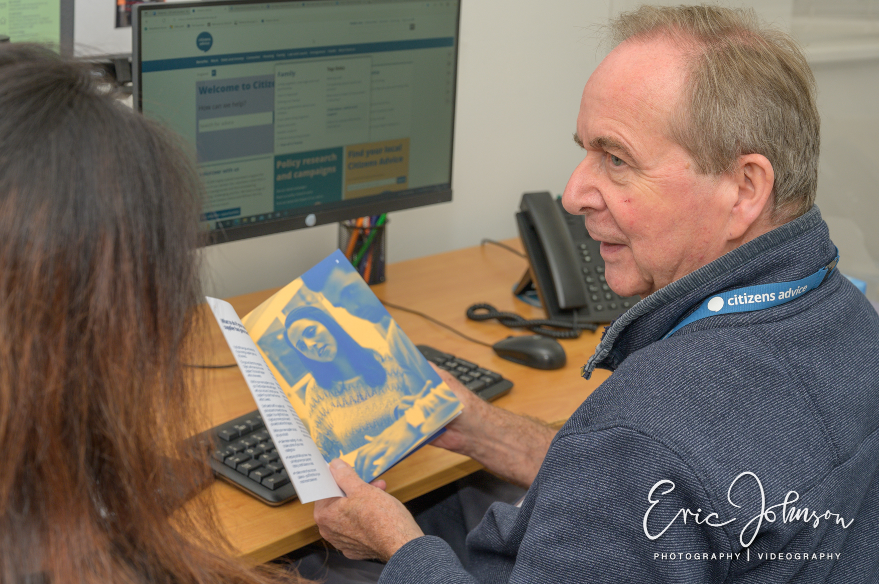 Photography for Citizens Advice 26 Citizens Advice volunteers working together during a client support session