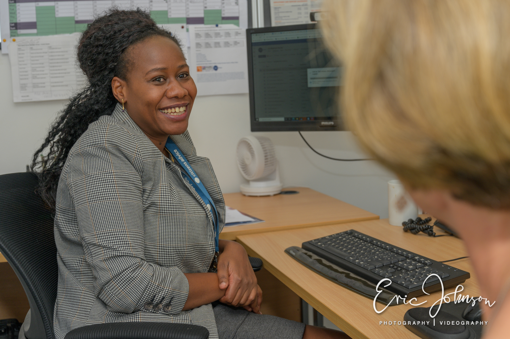 Photography for Citizens Advice 28 Citizens Advice volunteer speaking with a colleague in the Watford office